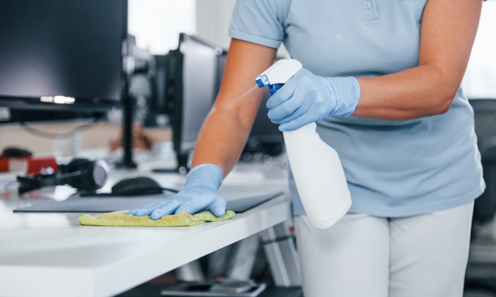 close-up-view-of-woman-in-protective-gloves-that-cleaning-tables-in-the-office.jpg