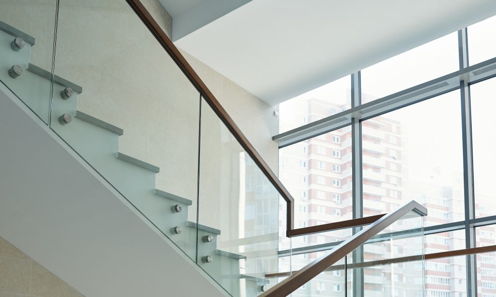 part-of-staircase-with-railings-and-large-window-inside-new-business-center.jpg