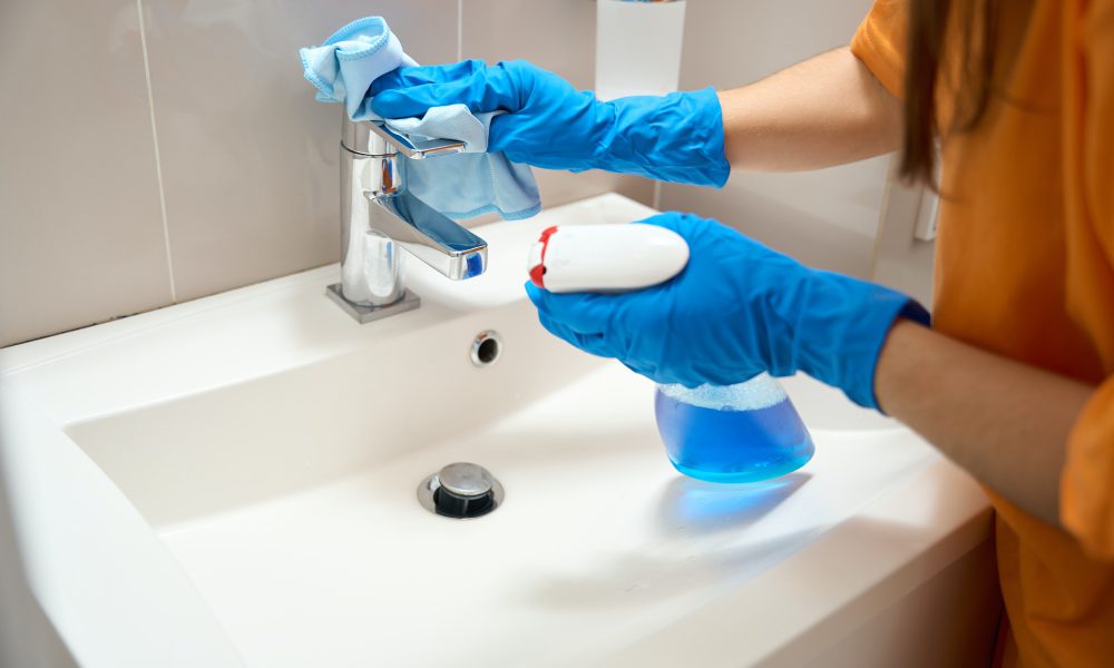 woman-from-cleaning-company-cleaning-washroom-fixtures.jpg